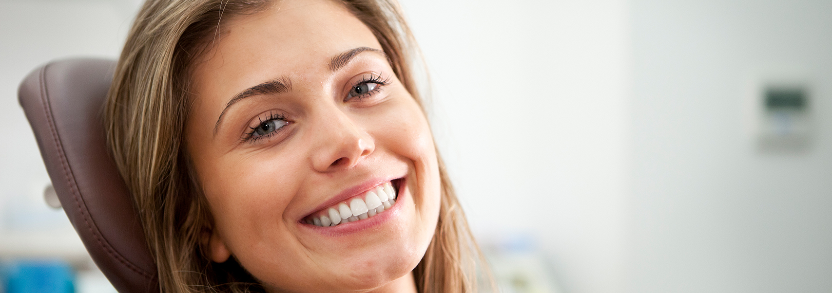 smiling woman sitting in a dental chair