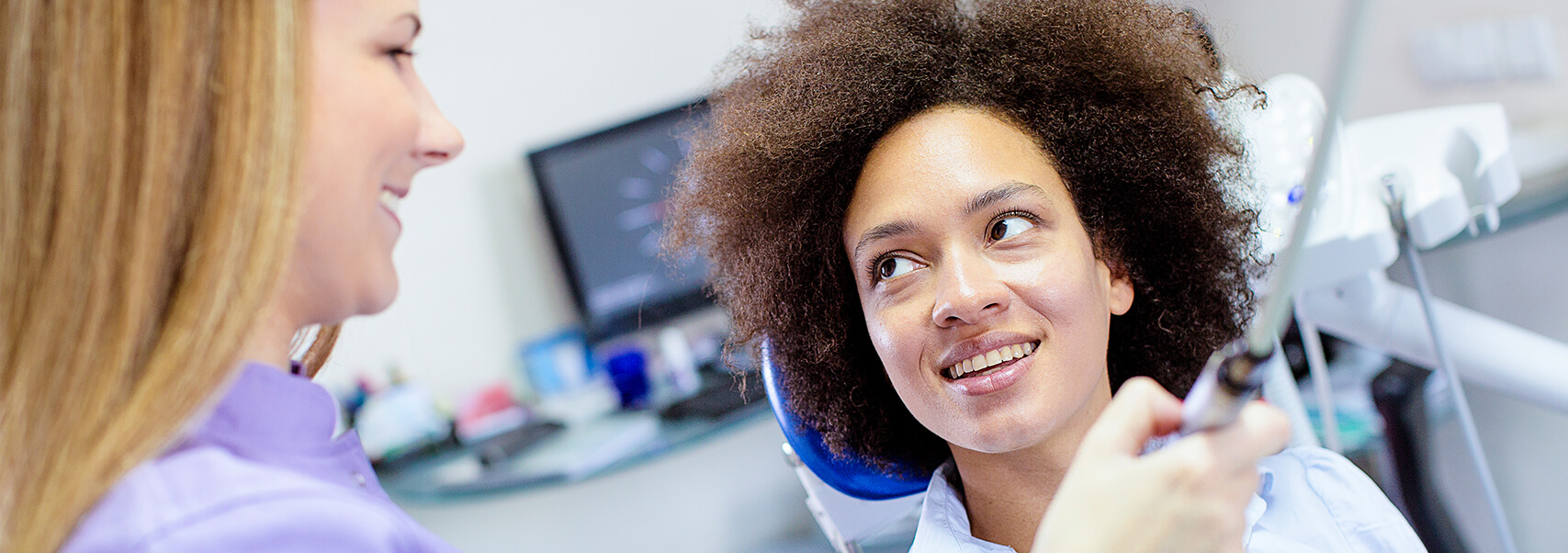 dental patient about to have her teeth scanned for a mouthguard fitting