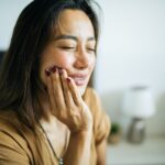 woman with dental pain toothache from failing filling