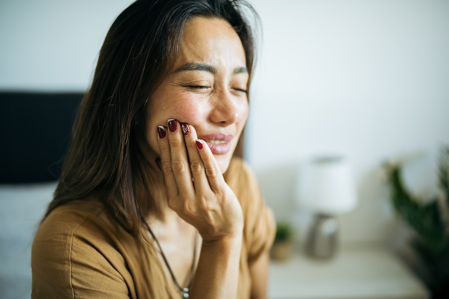 woman with dental pain toothache from failing filling